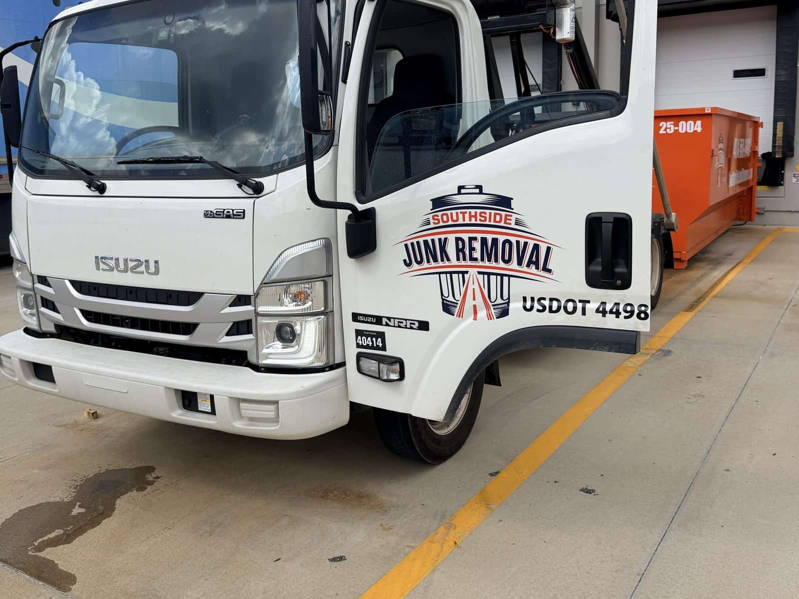 Southside roll-off truck at a warehouse loading bay in Union City