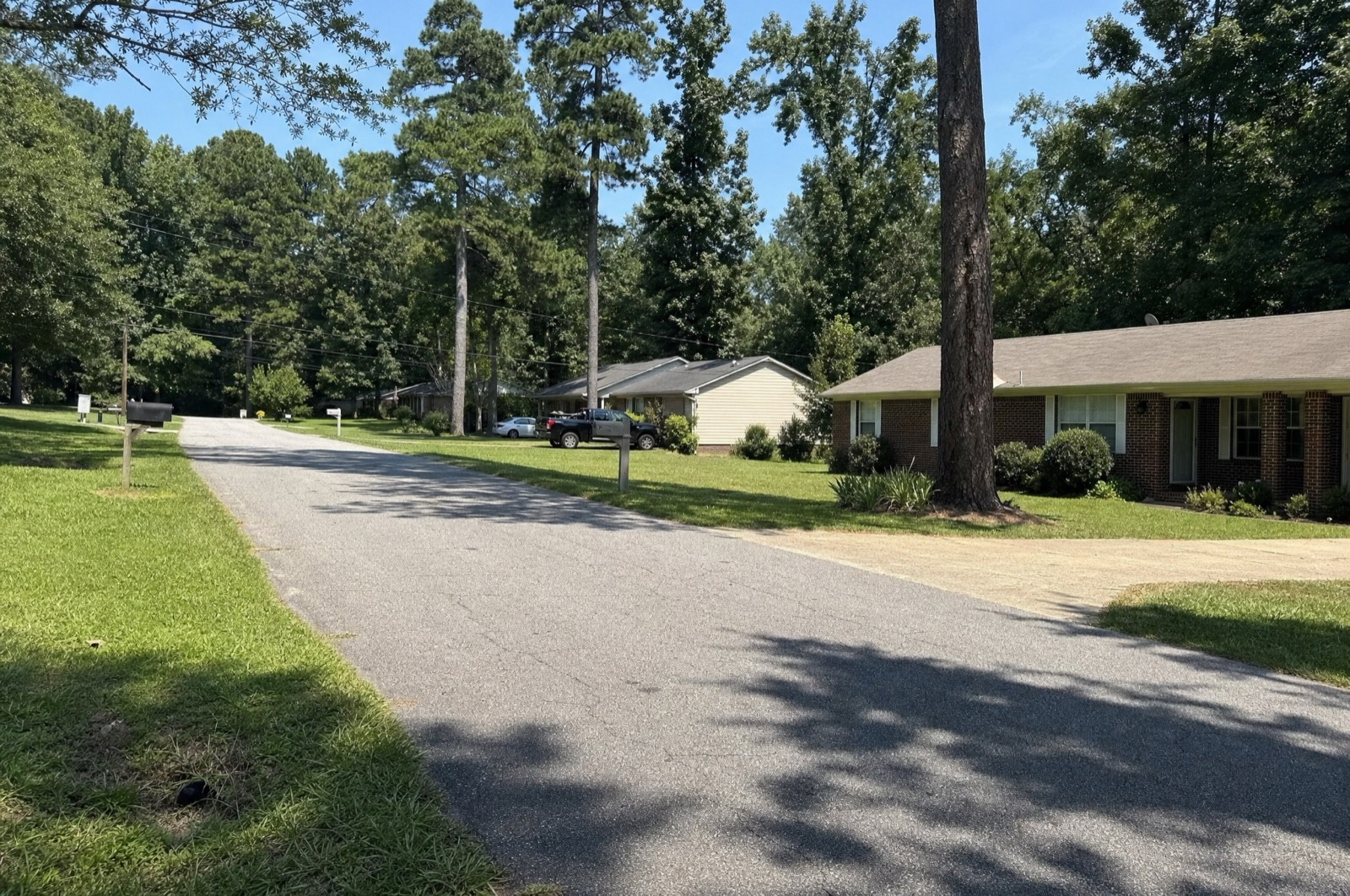 Ranch homes on a wooded residential street, Ellenwood, GA